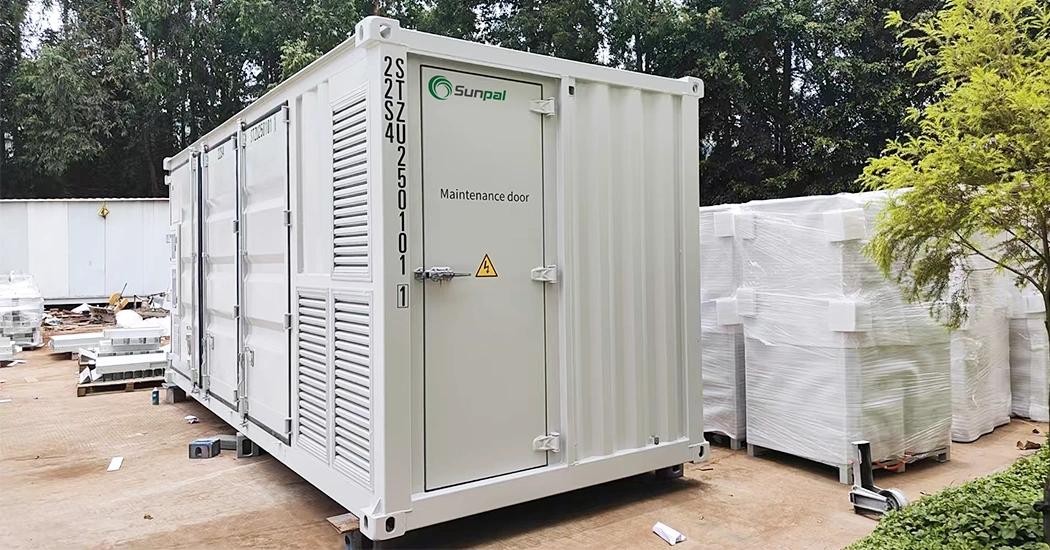 Exterior of a white Elecod containerized BESS showing the side access panel and designated maintenance door.