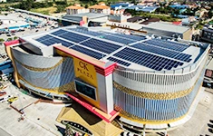 Aerial photo of the CK Plaza commercial shopping complex with solar PV panels installed across its flat roof.