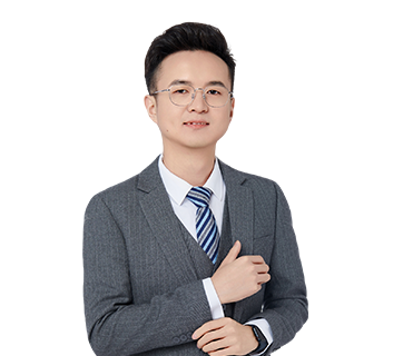 A three-quarter portrait of Daniel Zheng, the Operations Director, in a grey suit against a white background.