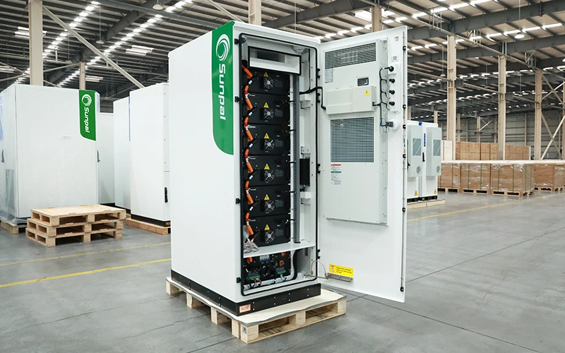 Open cabinet view of the Sunpal ECO-B100-120WP-2H energy storage system displaying stacked battery modules, internal wiring, BMS, and door-mounted HVAC cooling unit.