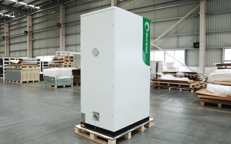 Side-rear view of the Sunpal ECO-B100-120WP-2H energy storage cabinet on a wooden pallet in a factory warehouse.