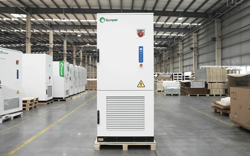 Front view of the Sunpal ECO-E261LP-2A energy storage cabinet sitting on a wooden pallet inside a manufacturing facility.