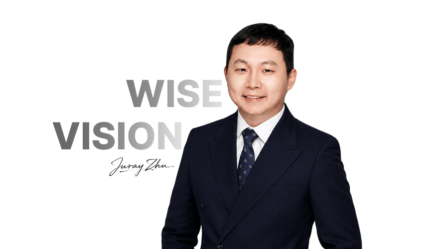 A professional portrait of CEO Juray Zhu in a double-breasted suit, with the words