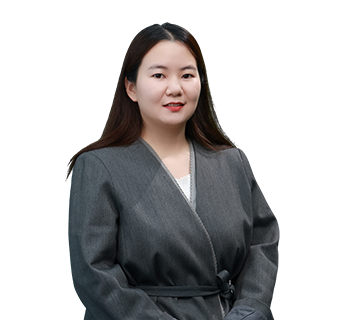 Professional portrait of Marketing Director Silvia Wang smiling, wearing a grey belted jacket against a plain white background.